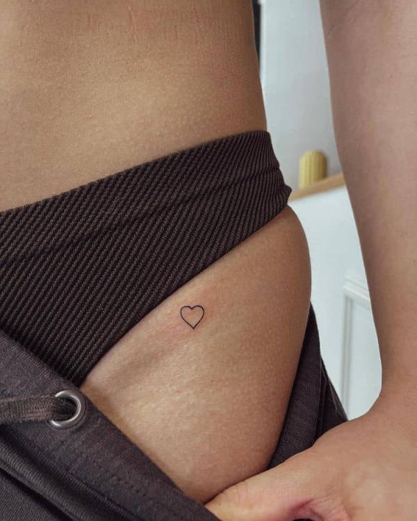 bikini line mini heart tattoo
