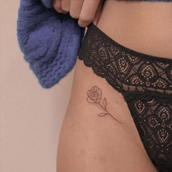 bikini line rose outline tattoo