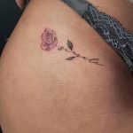 bikini line rose with name tattoo