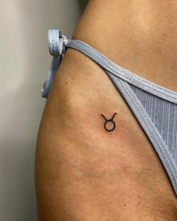 bikini line taurus glyph tattoo