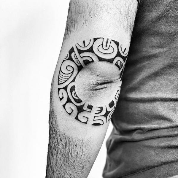 polynesian elbow tattoo