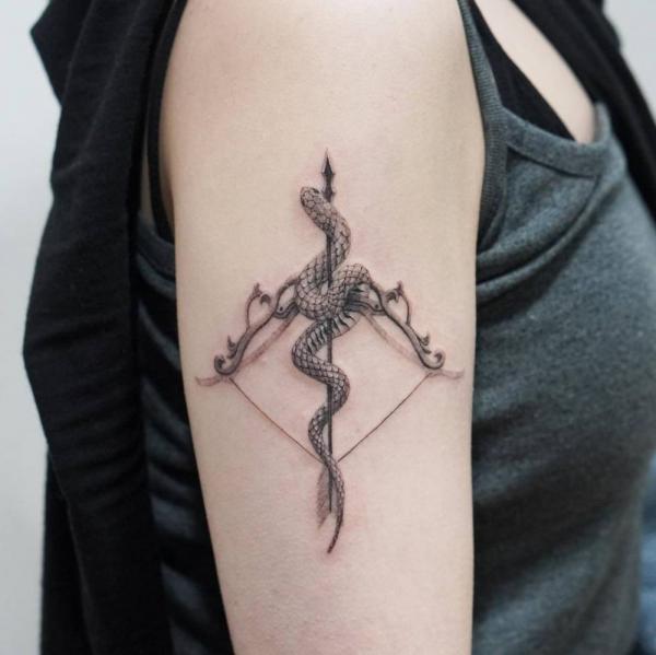 sagittarius arrow and bow with snake tattoo