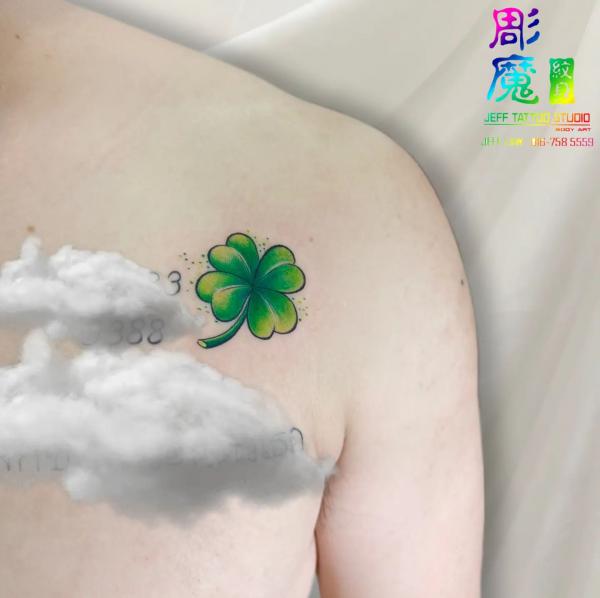 shamrock above chest tattoo