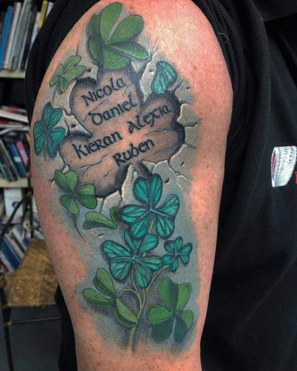 shamrock with names carved tattoo