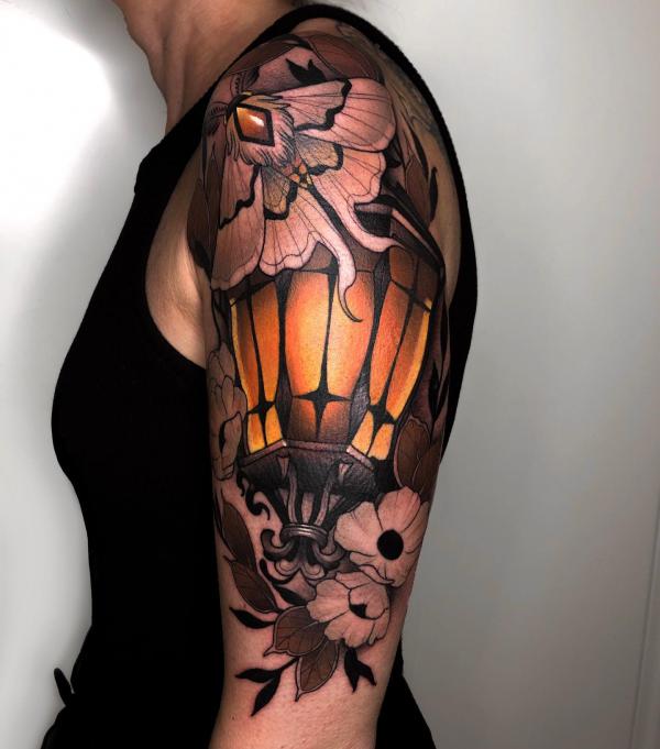 A luna moth on lantern tattoo half sleeve