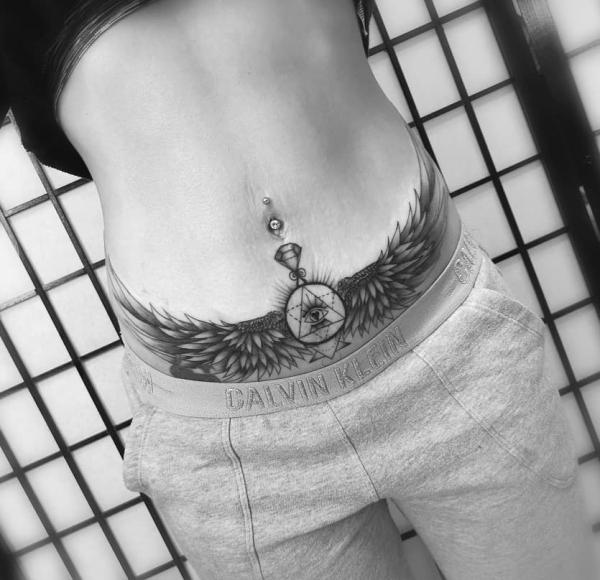 All seeing eye with wings tummy tattoo