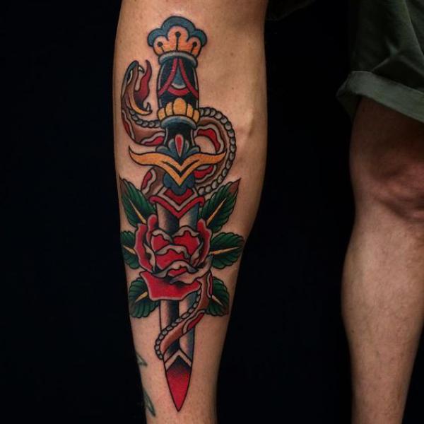 American tradiitonal dagger though rose and snake tattoo