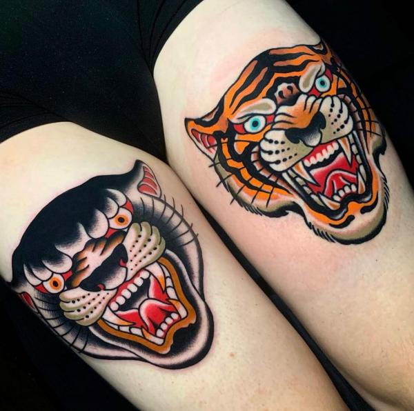 American traditional panther and tiger knee tattoo