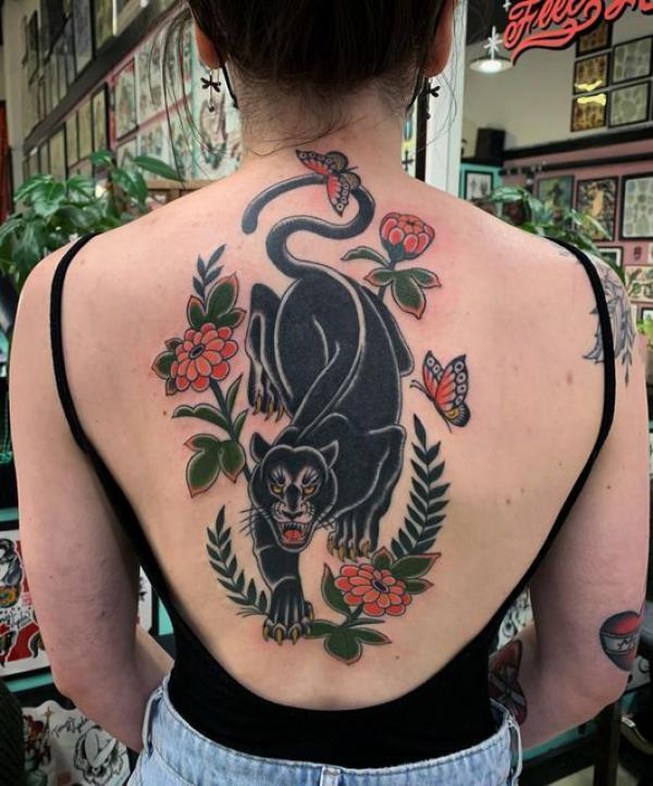 American traditional panther with flower and butterfly tattoo on back