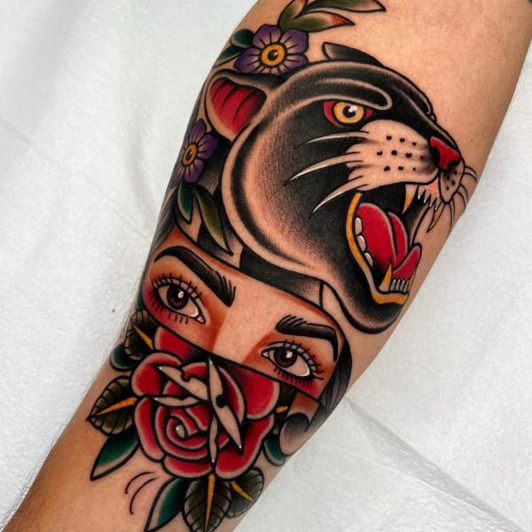 American traditional panther womans eyes and rose tattoo forearm