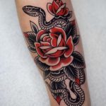 American traditional rose and snake tattoo forearm