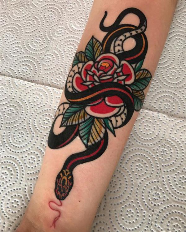 American traditional snake and rose tattoo forearm
