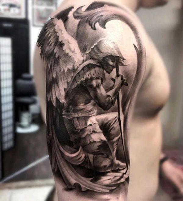 Archangel Michael kneeling with sword