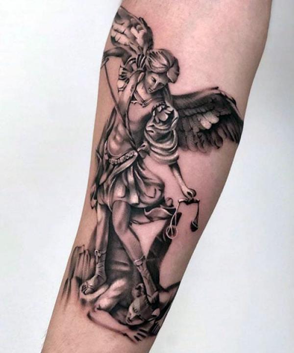 Archangel Michael slaying the devil with sword and the scales of justice