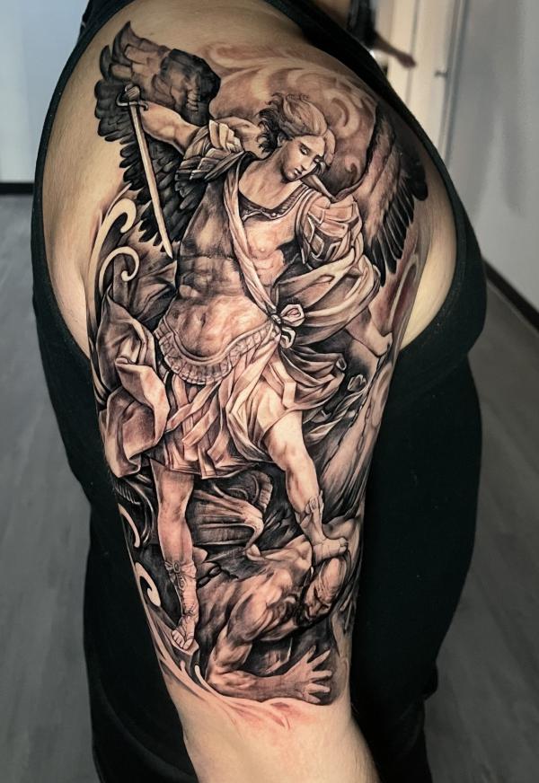 Archangel michael defeating lucifer half sleeve tattoo