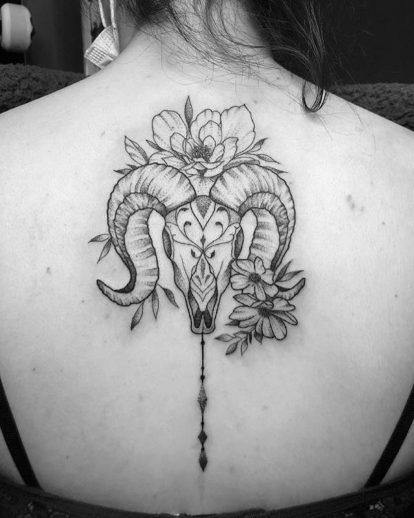 Aries Ram skull with flowers tattoo black and grey