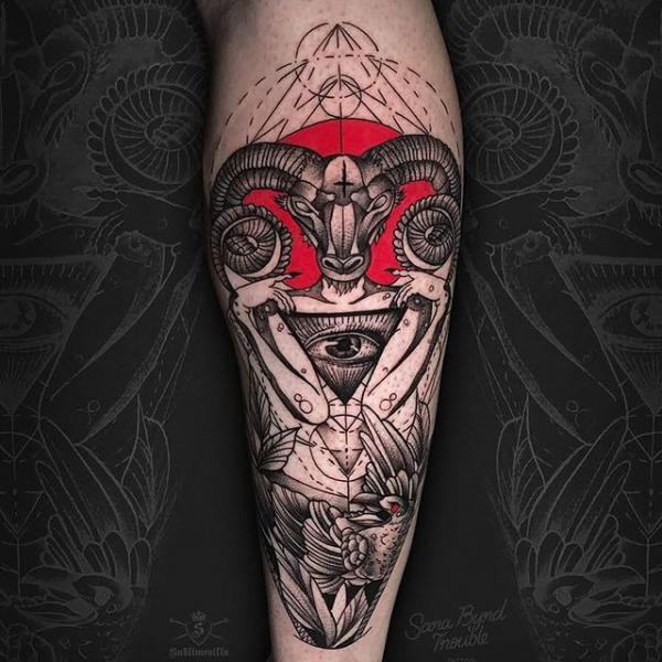 Aries Ram with eye calf tattoo