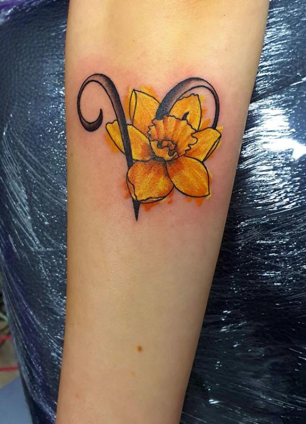 Aries and daffodil tattoo