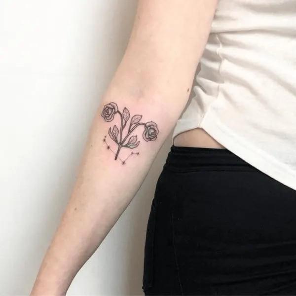 Aries floral glyph with constellation tattoo