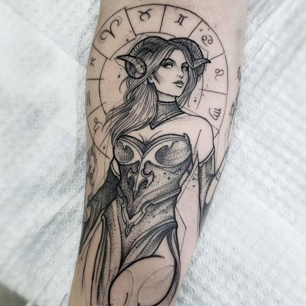 Aries girl with Zodiac wheel tattoo