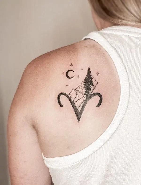 Aries glyph with mountain moon and stars tattoo on shoulder blade