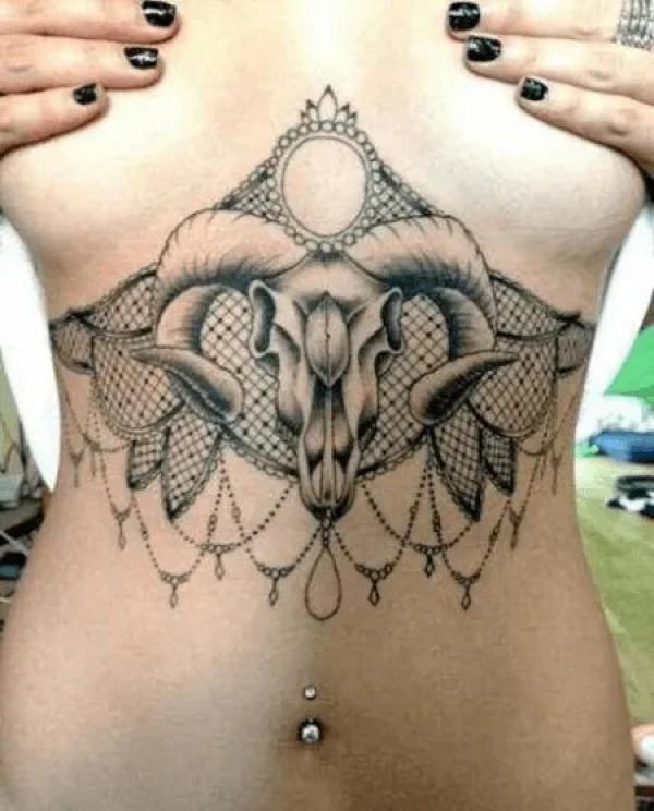 Aries ram and lace sternum tattoo