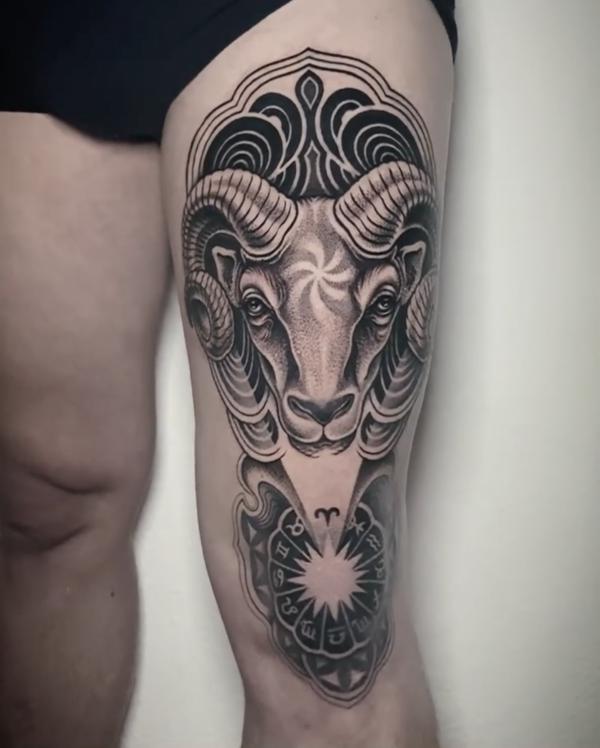 Aries ram and zodiac wheel tattoo from front thigh to knee