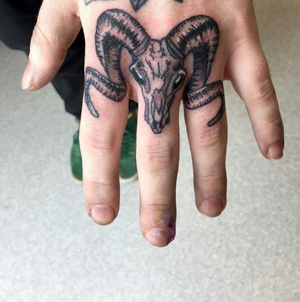 Aries ram finger tattoo