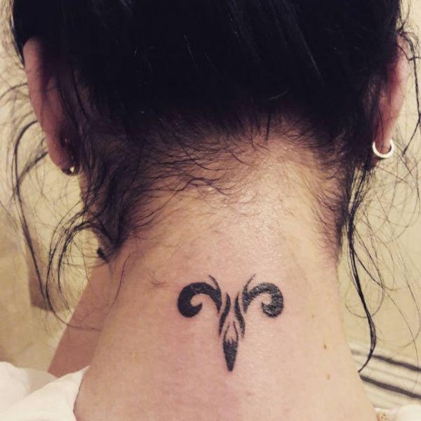 Aries tattoo on back of neck