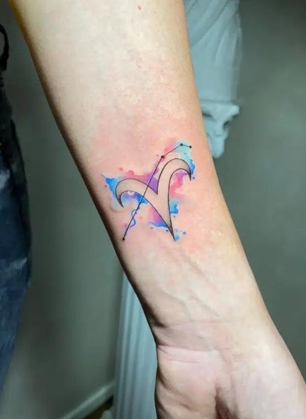 Aries with constellation linework tattoo on watercolor backdrop