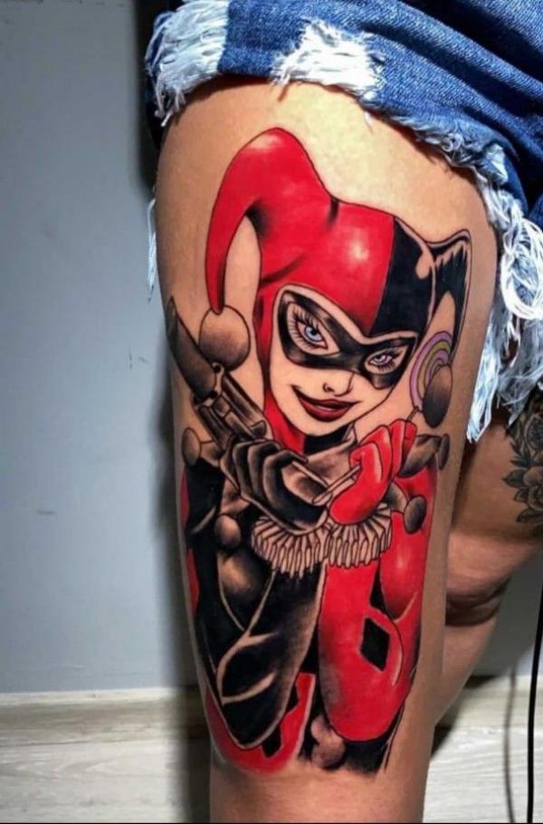 Batman Harley Quinn with gun thigh tattoo
