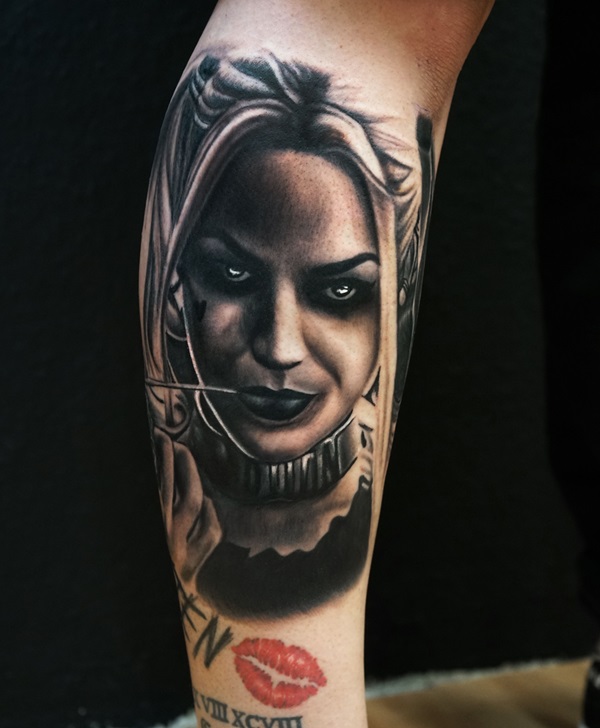 Black Harley Quinn portrait and red lips tattoo