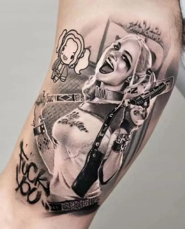 Black and grey Harley Quinn bicep tattoo