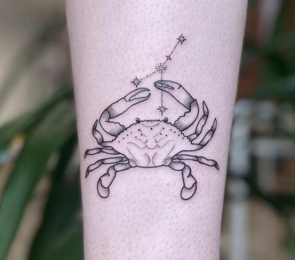 Black and grey Zodiac cancer with constellation tattoo