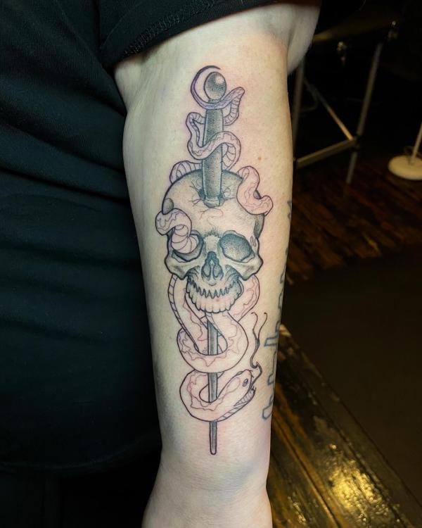 Black and grey death eater and magic wand tattoo