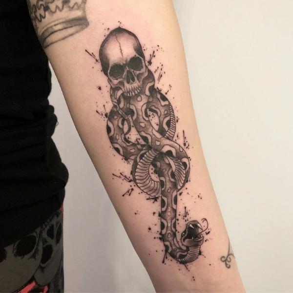 Black and grey death eater forearm tattoo