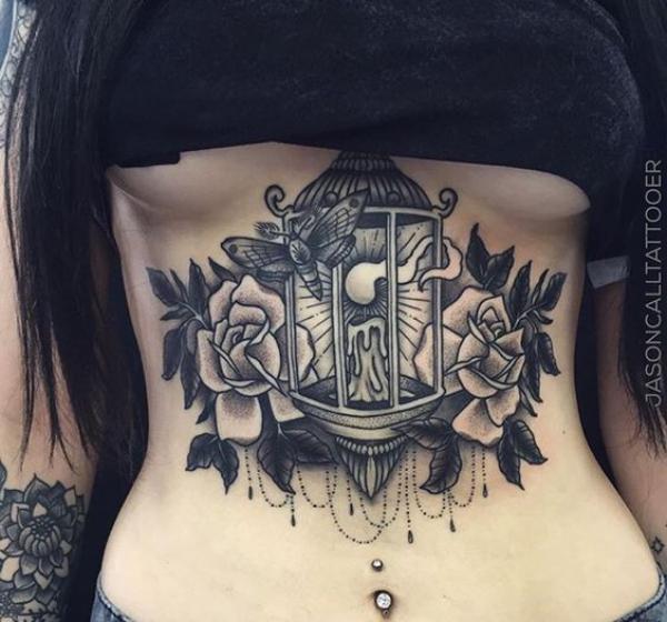 Black and grey lantern with roses stomach tattoo