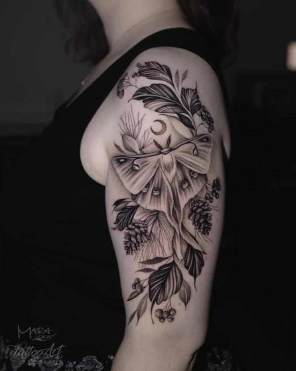 Black and grey luna moth and pinecone with crescent moon tattoo half sleeve