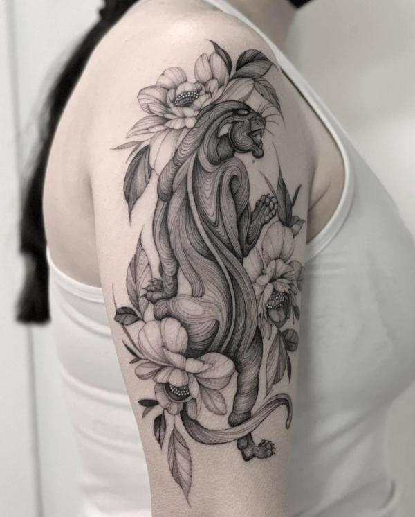 Black and grey panther with flowers half sleeve tattoo
