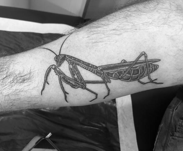 Black and grey praying mantis forearm tattoo for men