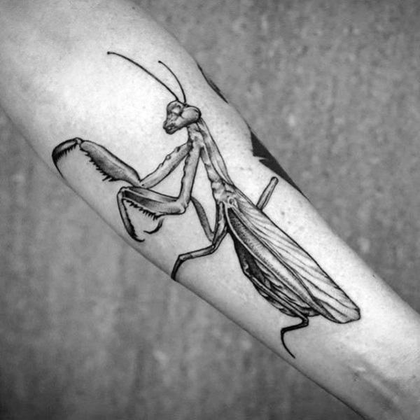 Black and grey praying mantis tattoo forearm