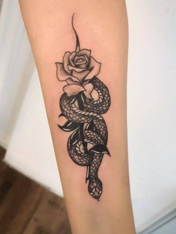 Black and grey rose and snake tattoo forearm