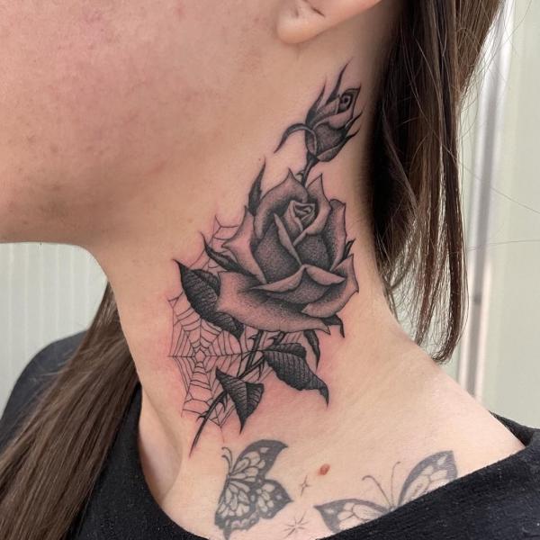 Black and grey rose with spider web neck tattoo