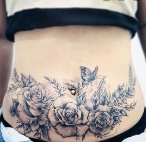 Black and grey roses and butterfly tummy tattoo