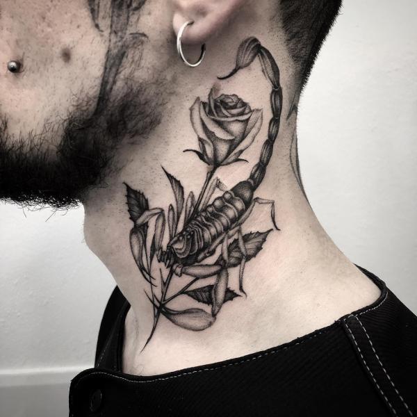 Black and grey scorpion and rose neck tattoo