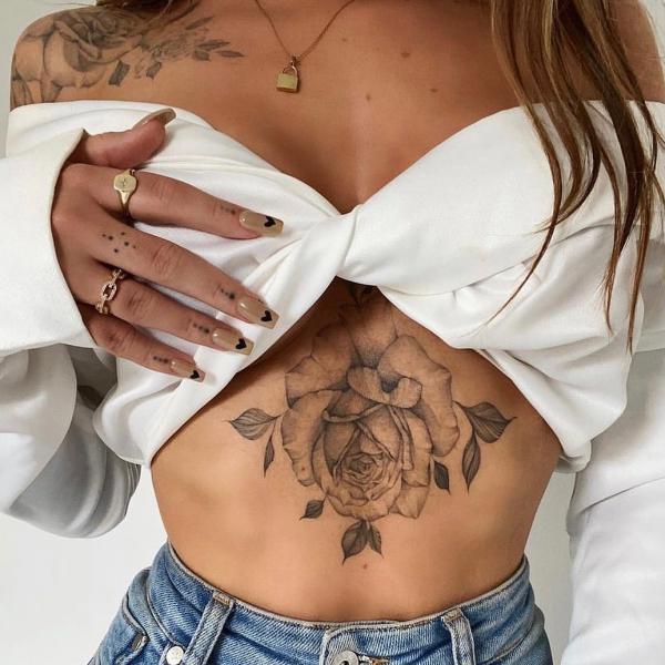 Black and grey stomach rose tattoo
