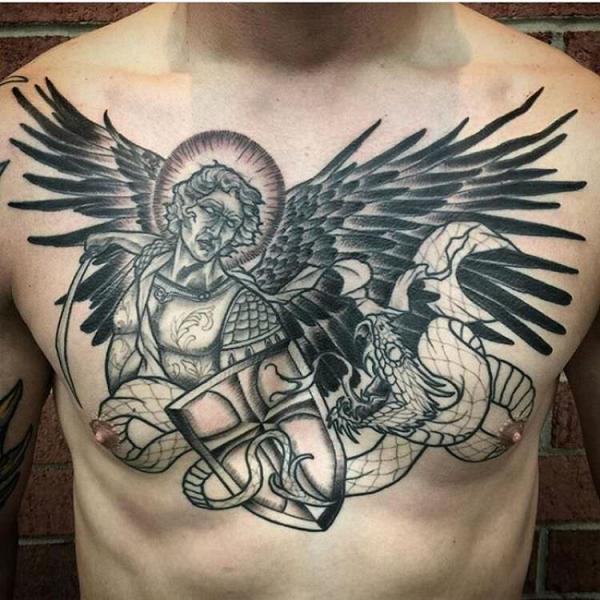 Black and white Archangel Michael fighting dragon chest tattoo