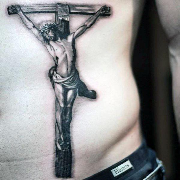 Black and white cross tattoo with jesus on back