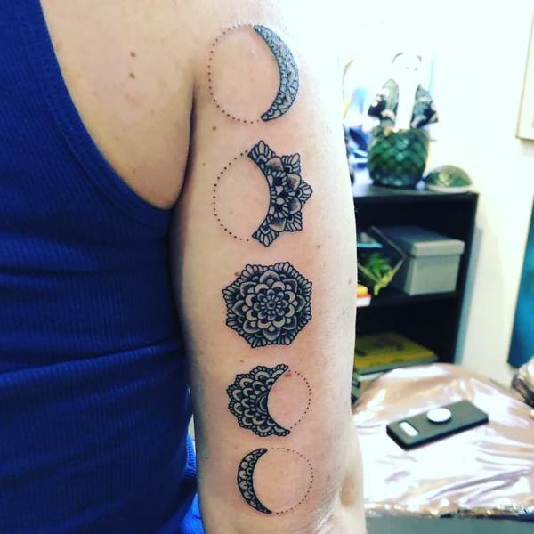 Black and white mandala moon phases half sleeve tattoo