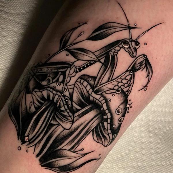 Black and white praying mantis and mushroom tattoo